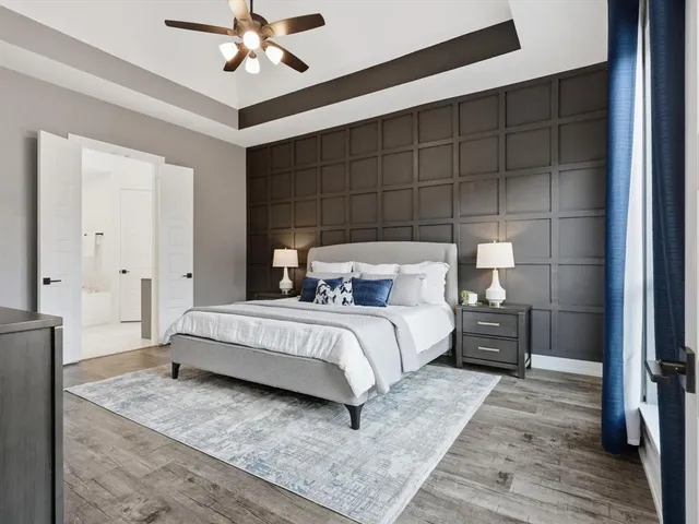 a bed room with a bed and a chandelier