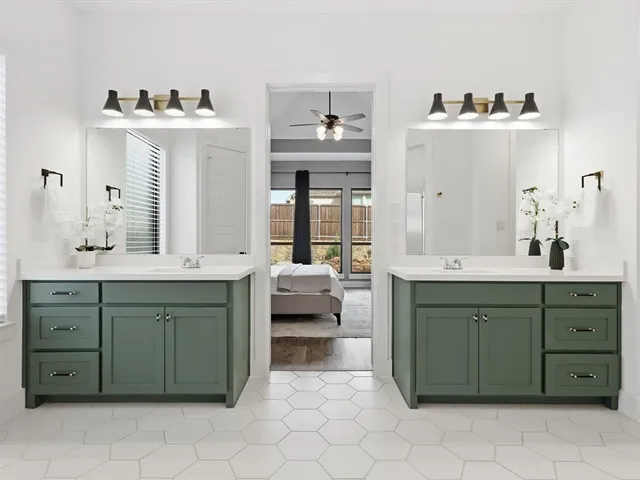 a spacious bathroom with a sink double vanity and a mirror