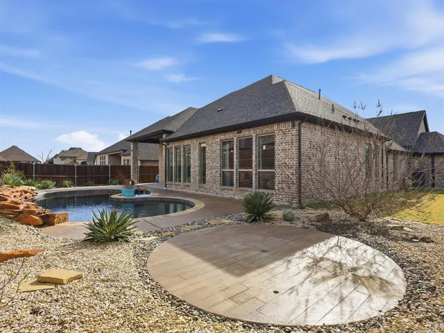 a view of a swimming pool with a lounge chair