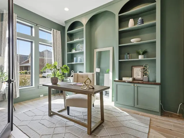 a view of a dining room with furniture and window