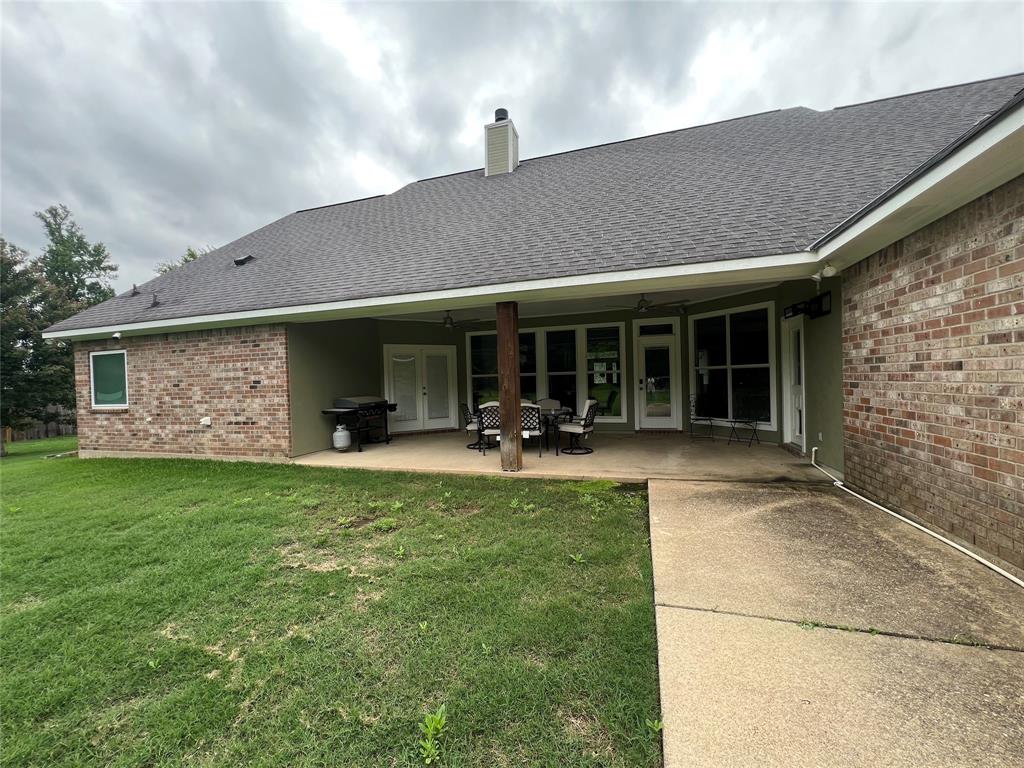 5270 Quad J Road Shreveport, LA 71107 - Photo 17 of 18 a view of a house with backyard porch and porch