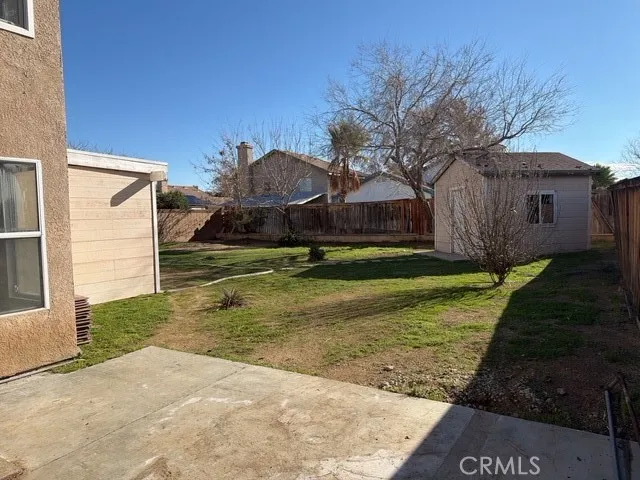 a view of a back yard of the house