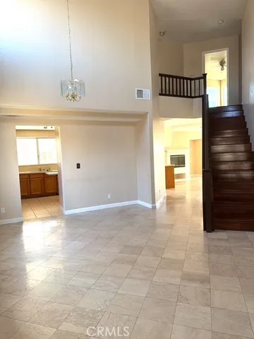 a view of a kitchen with a sink and a window