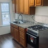 a kitchen with a stove and a sink
