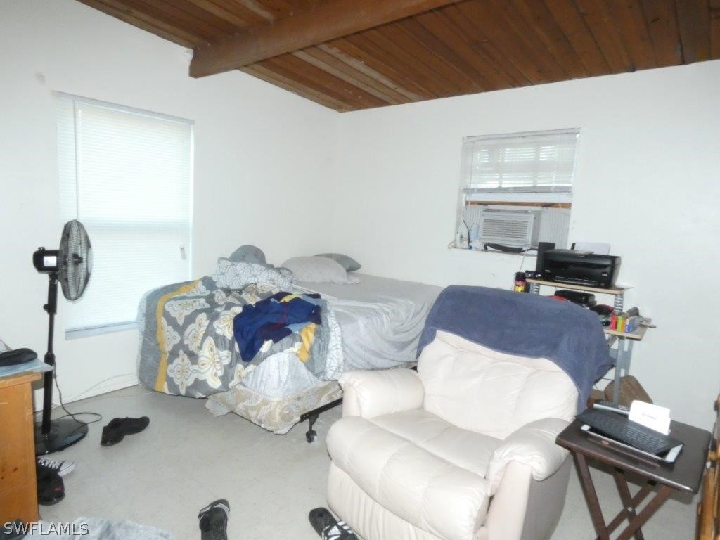 4519 Luckett Road Fort Myers, FL 33905 - Photo 11 of 26 a living room with furniture flowerpot and window