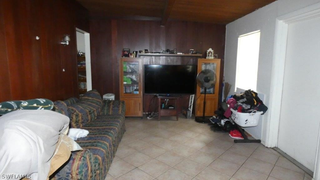 4519 Luckett Road Fort Myers, FL 33905 - Photo 12 of 26 a living room with furniture and a flat screen tv