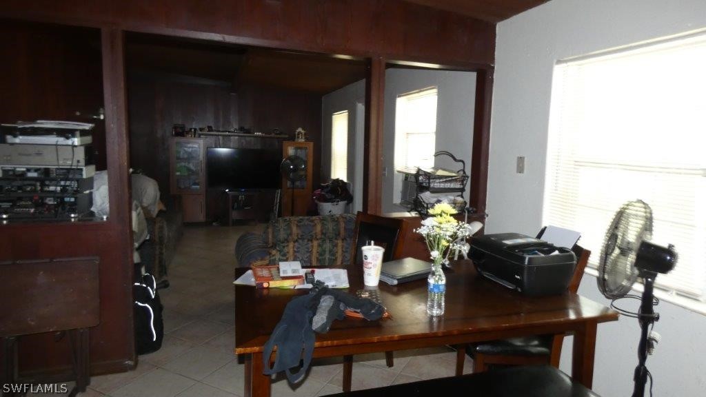 4519 Luckett Road Fort Myers, FL 33905 - Photo 18 of 26 a dining room with furniture and chandelier