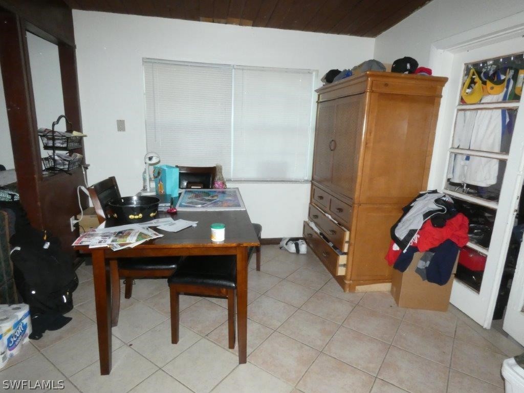 4519 Luckett Road Fort Myers, FL 33905 - Photo 5 of 26 a room with furniture a rug and a table