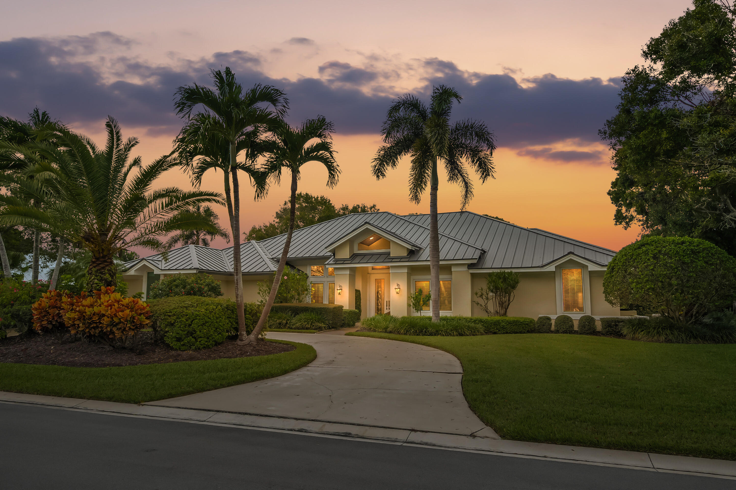 6217 Southeast Baltusrol Terrace Stuart, FL 34997 - Photo 3 of 69 front view of a house with a yard