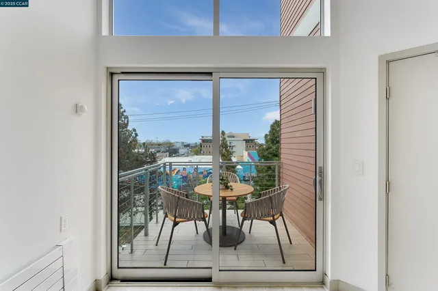 a view of a dining room with furniture and a window