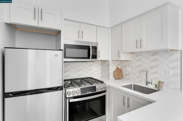 a kitchen with a stove and a microwave