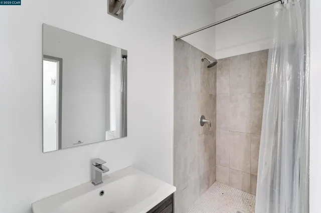 a bathroom with a sink and mirror