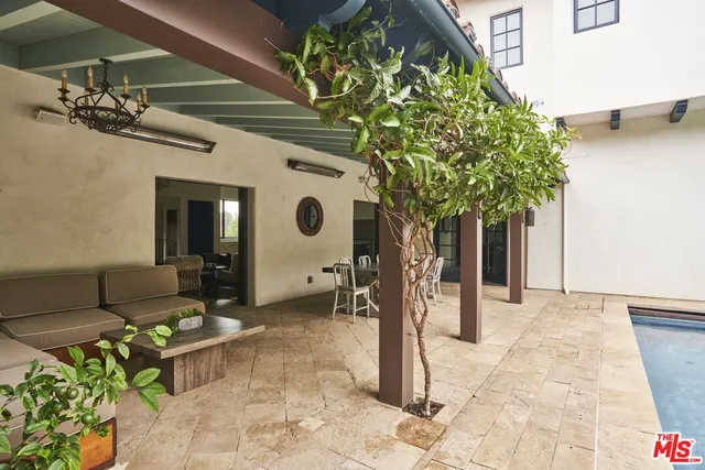 a spacious bedroom with a bed and a flat screen tv