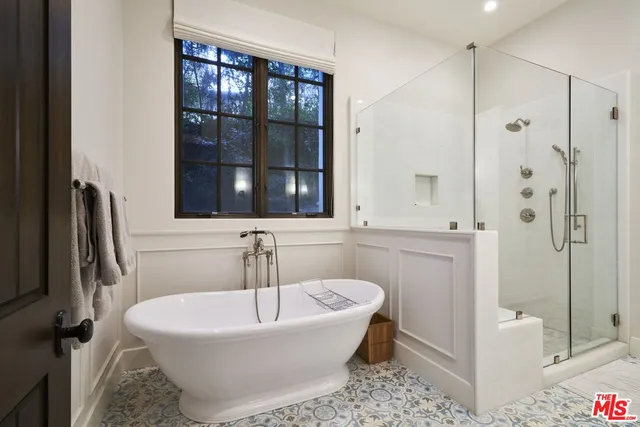 a bedroom with bed and a window