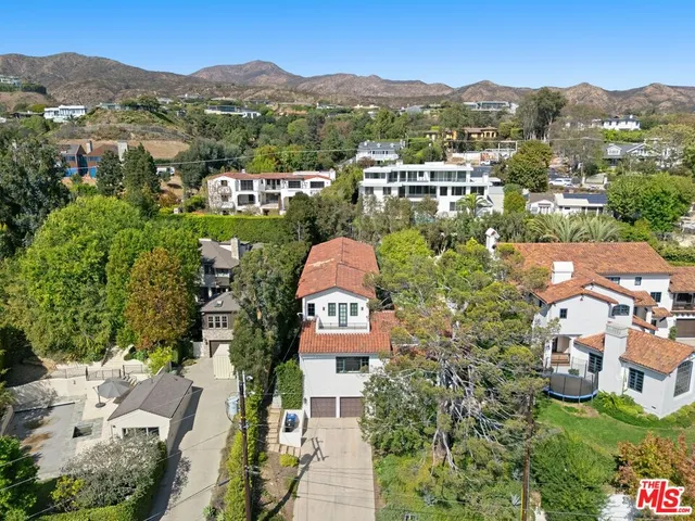 an aerial view of residential house with an outdoor space