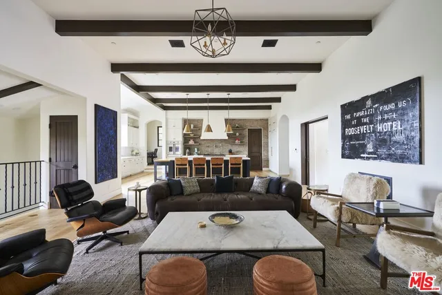 a large kitchen with stainless steel appliances granite countertop a lot of counter space