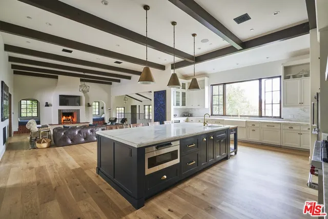 a kitchen that has a sink and a stove