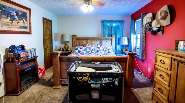 a bedroom with furniture and a baby crib