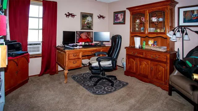 a backyard of a house with barbeque oven table and chairs