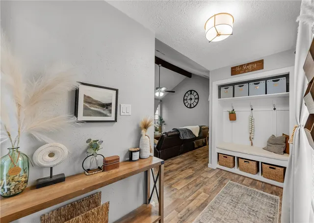 a living room with furniture and a table