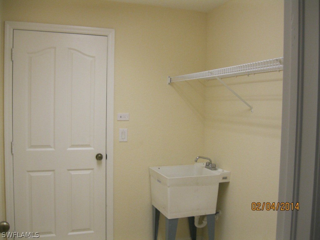 18225 Fuchsia Road Fort Myers, FL 33967 - Photo 12 of 23 a bathroom with a sink a shower and a window