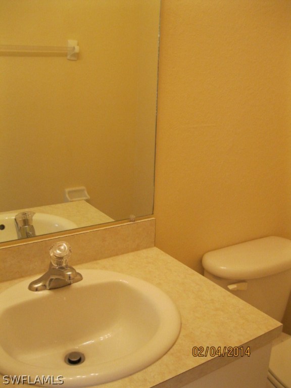 18225 Fuchsia Road Fort Myers, FL 33967 - Photo 20 of 23 a bathroom with a sink and a toilet
