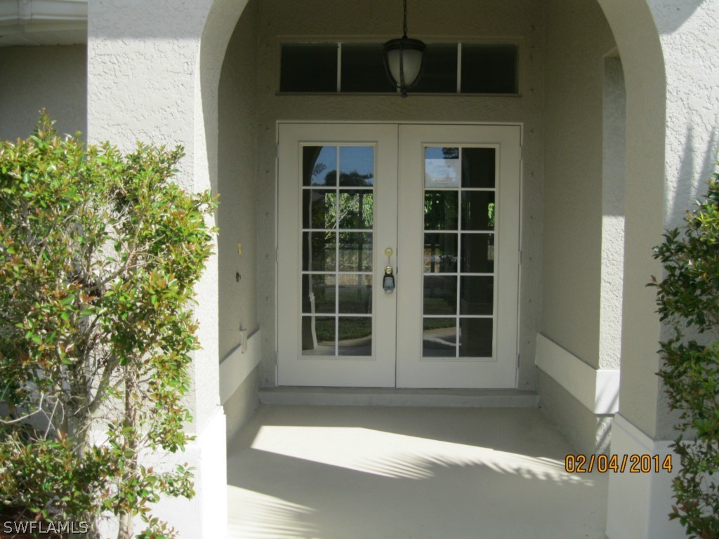 18225 Fuchsia Road Fort Myers, FL 33967 - Photo 2 of 23 a front view of a house with a yard