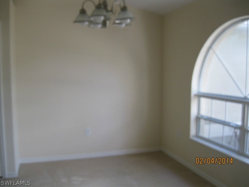 18225 Fuchsia Road Fort Myers, FL 33967 - Photo 5 of 23 an empty room with a window
