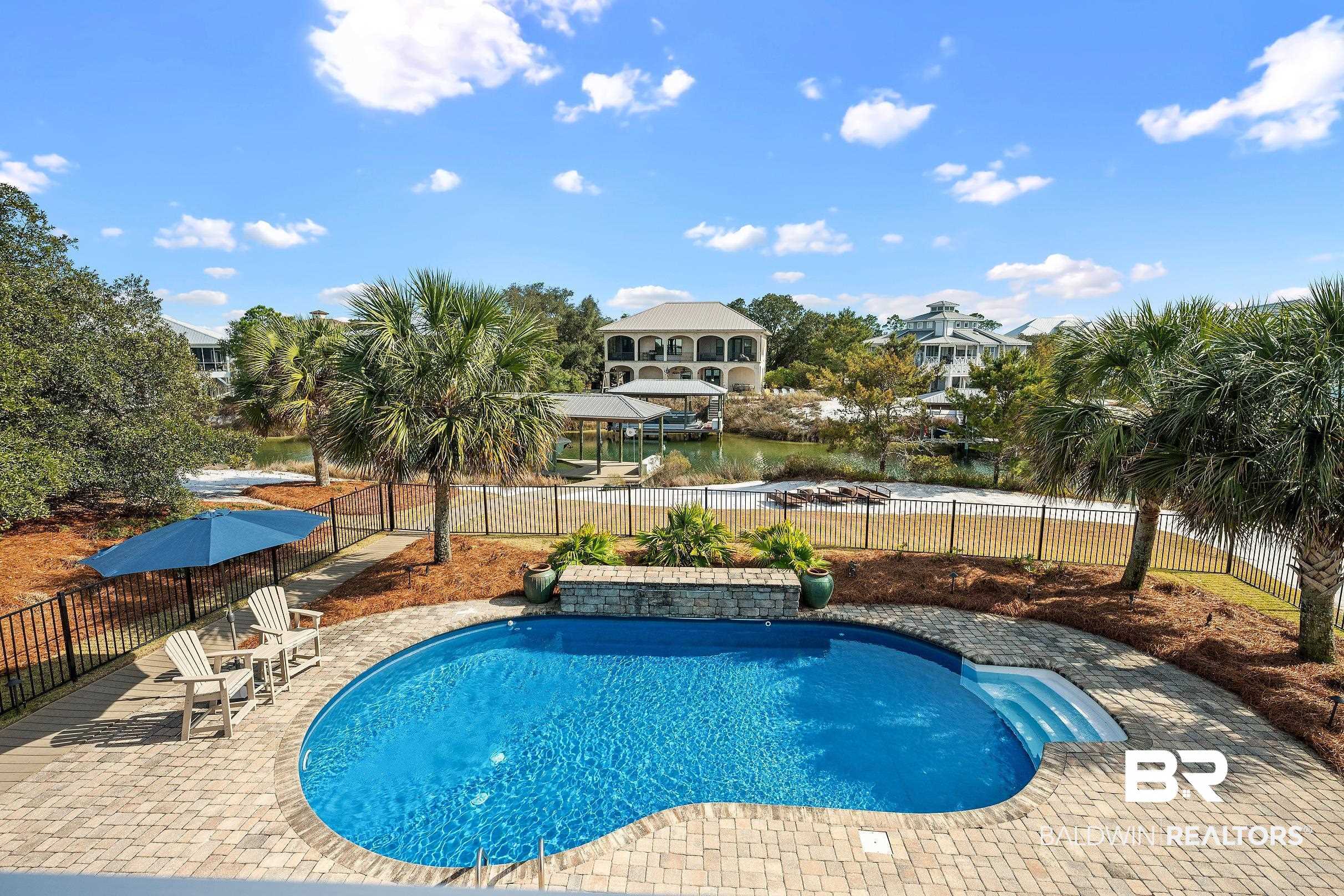 33186 Marlin Key Drive Orange Beach, AL 36561 - Photo 32 of 87 View of pool featuring patio surround and a fenced backyard