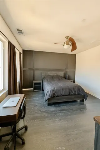 a bedroom with a bed and a table