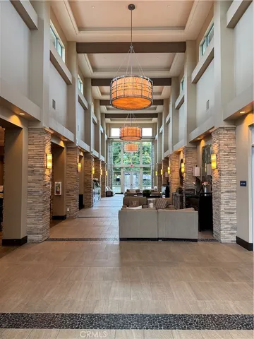 a living room with fireplace furniture and a chandelier