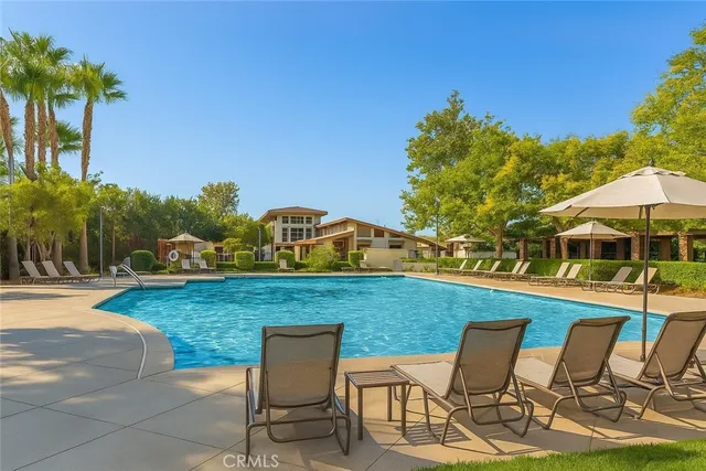 a view of a chairs and table on the patio