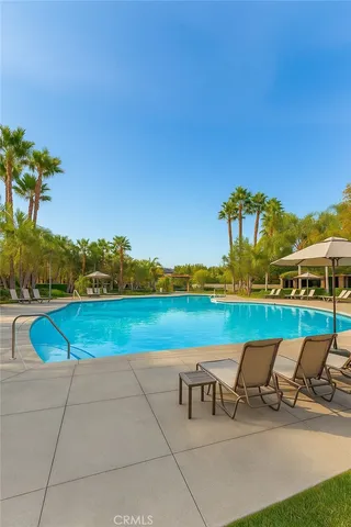 a view of a lake with couches chairs