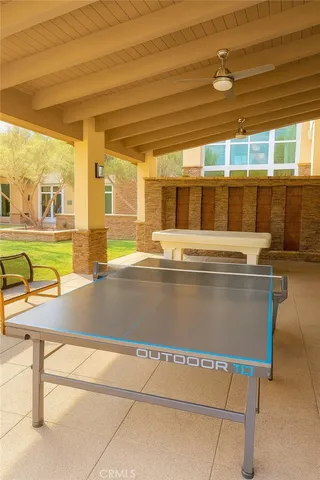 a view of backyard with swimming pool and outdoor seating