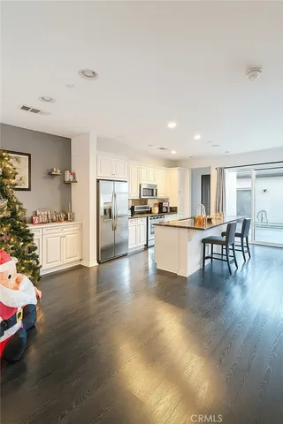 a kitchen with a table and chairs