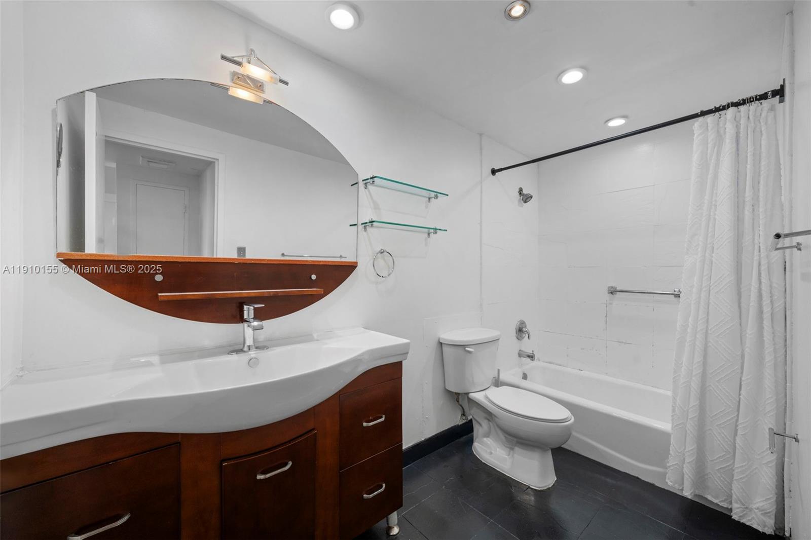 3301 Northeast 5th Avenue, Unit 214 Miami, FL 33137 - Photo 23 of 23 a bathroom with a sink a toilet and shower