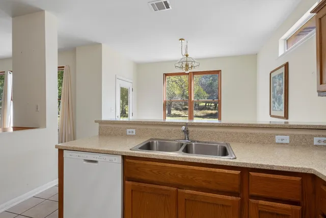 a kitchen with a sink and a window