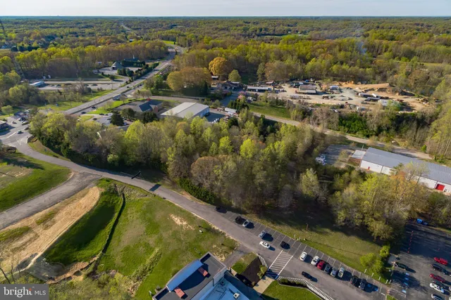 an aerial view of a residential houses with outdoor space