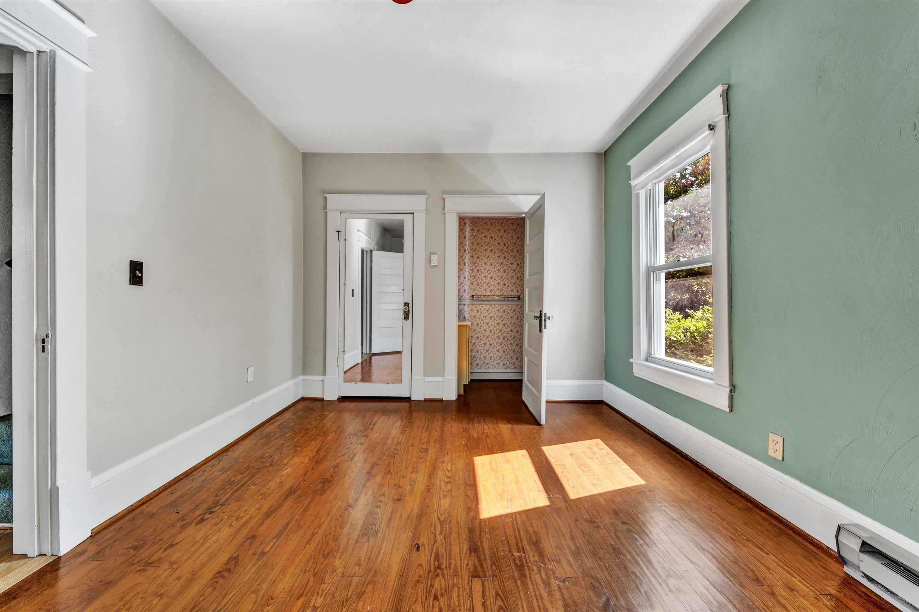 2744 Highland Road Roanoke, VA 24014 - Photo 17 of 29 a view of an empty room with wooden floor and a window