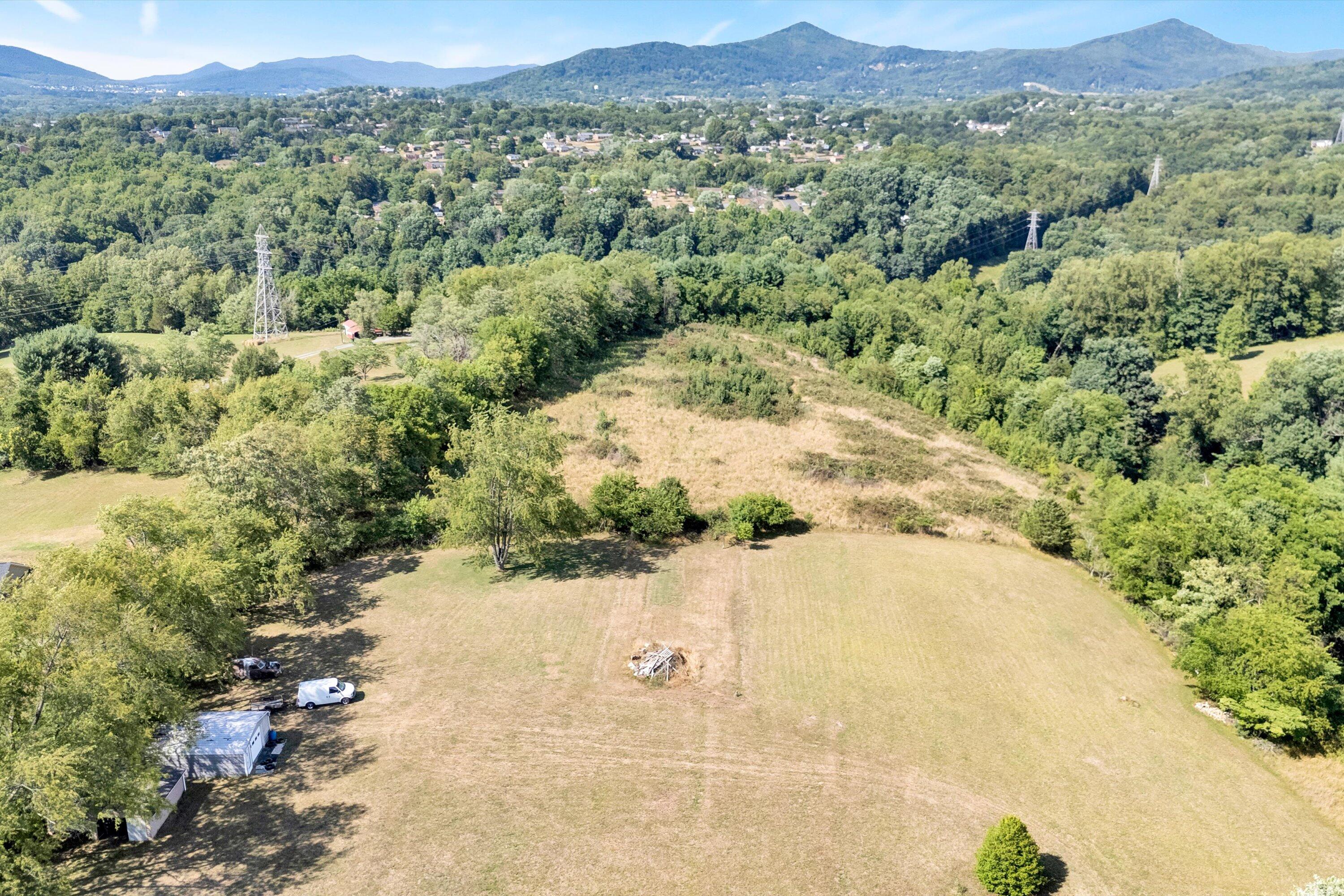 2744 Highland Road Roanoke, VA 24014 - Photo 23 of 29 a view of a field with a tree in the background