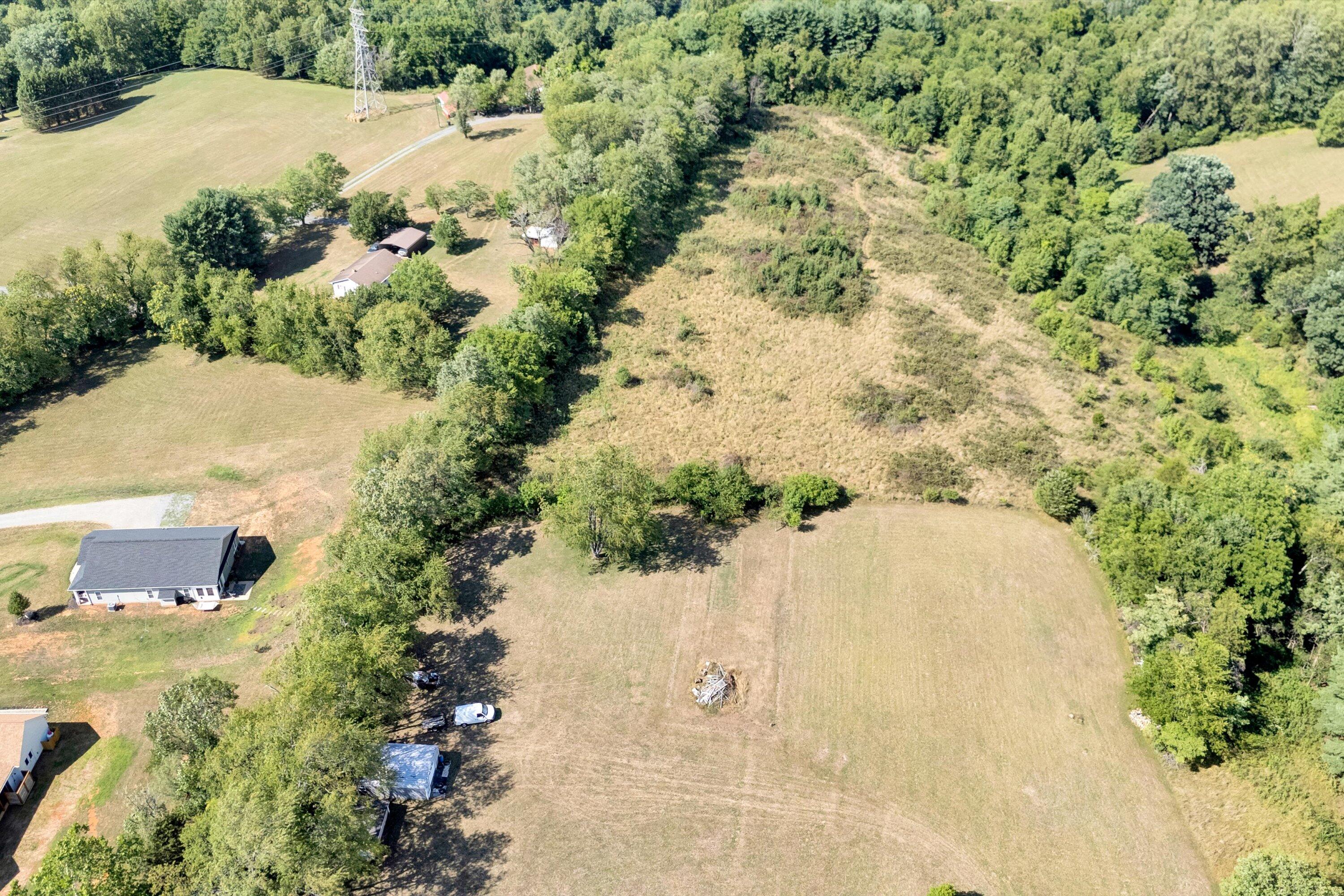 2744 Highland Road Roanoke, VA 24014 - Photo 27 of 29 an aerial view of a house with a yard and trees