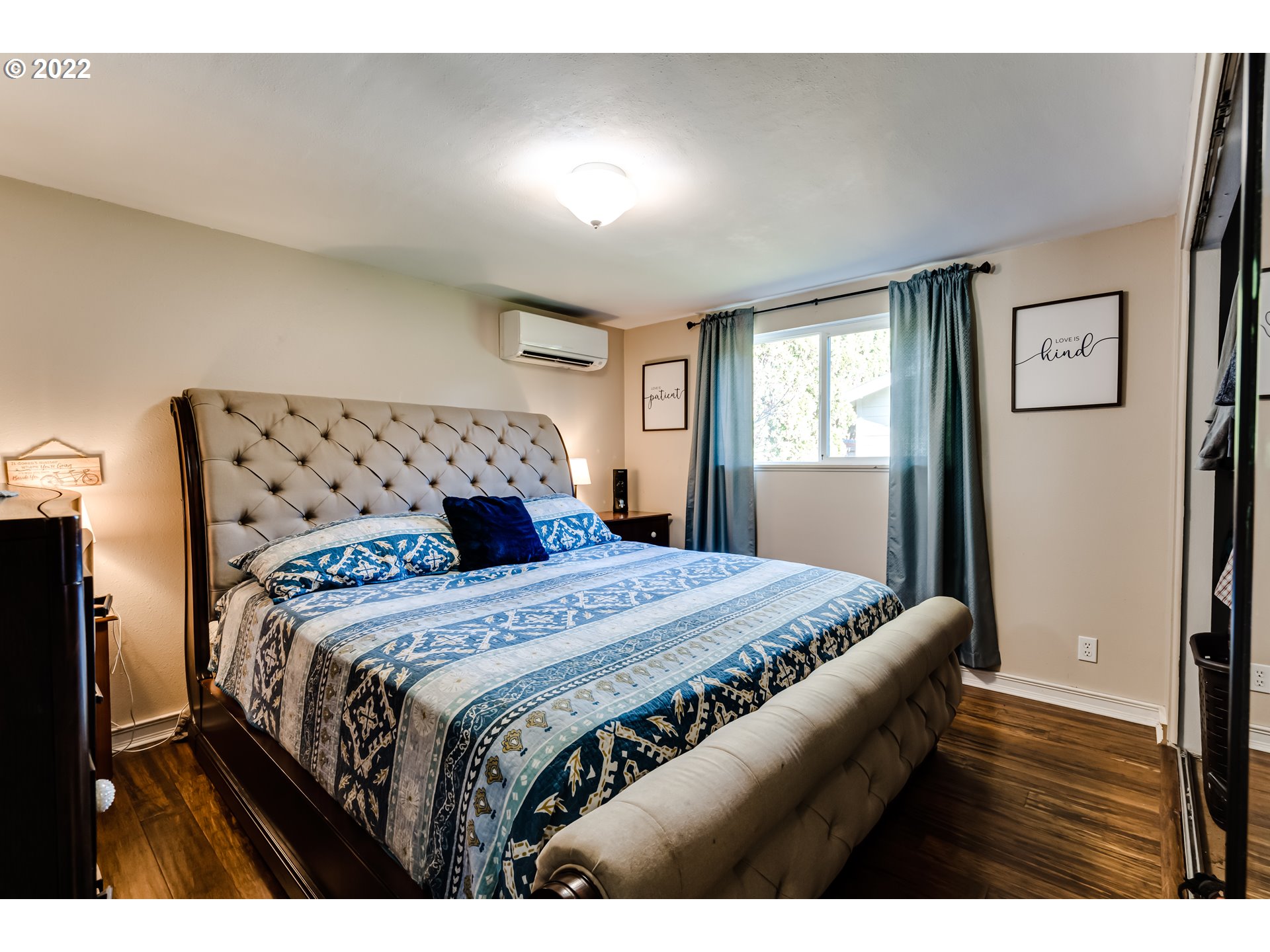 487 65th Street Springfield, OR 97478 - Photo 13 of 20 a bedroom with a bed with wooden floor