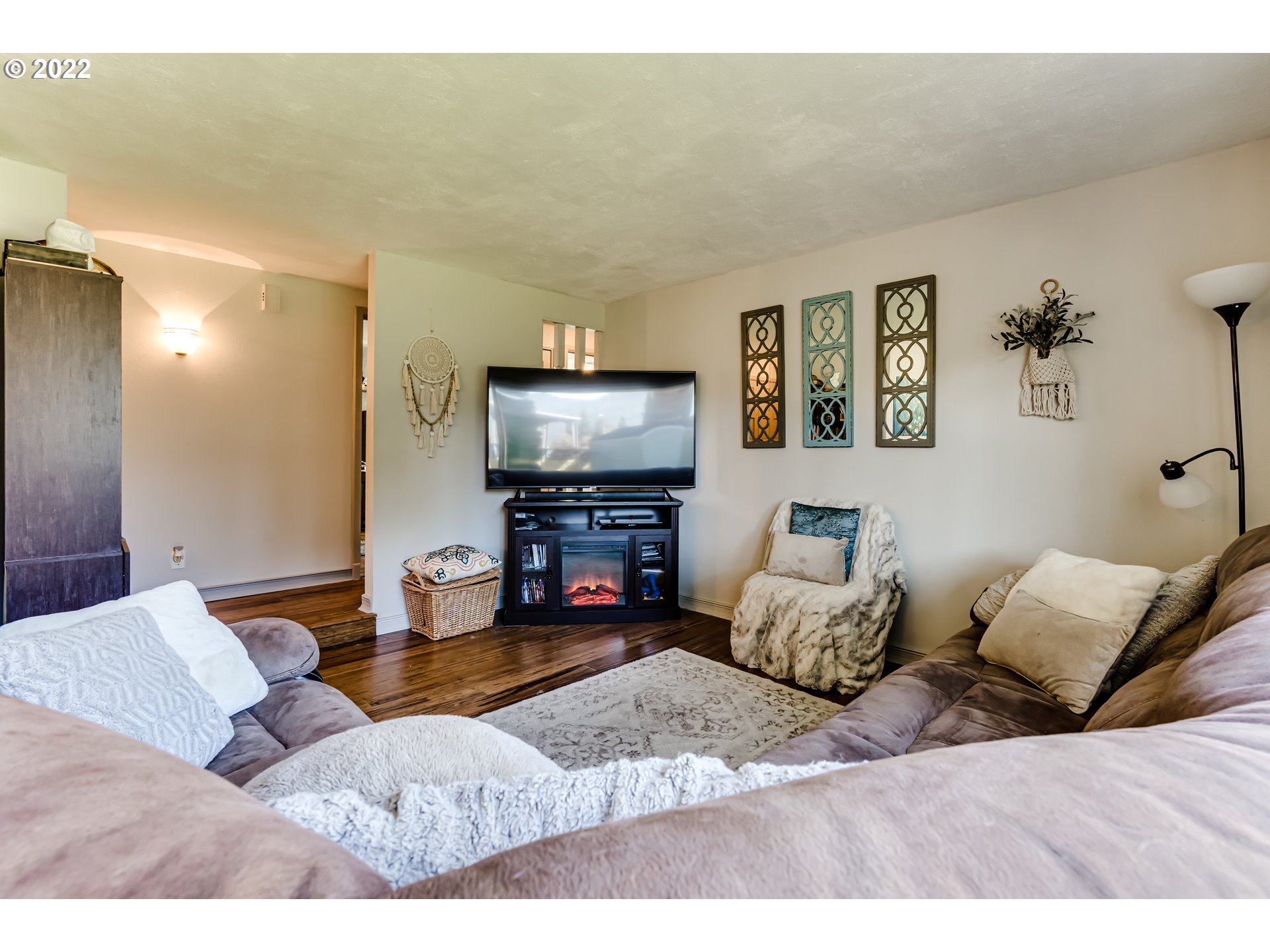 487 65th Street Springfield, OR 97478 - Photo 8 of 20 a living room with furniture and a flat screen tv