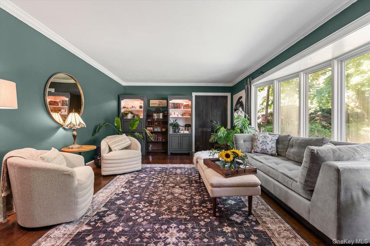 10 Rancher Place Huntington, NY 11743 - Photo 6 of 44 Living area featuring hardwood flooring and a large bay window