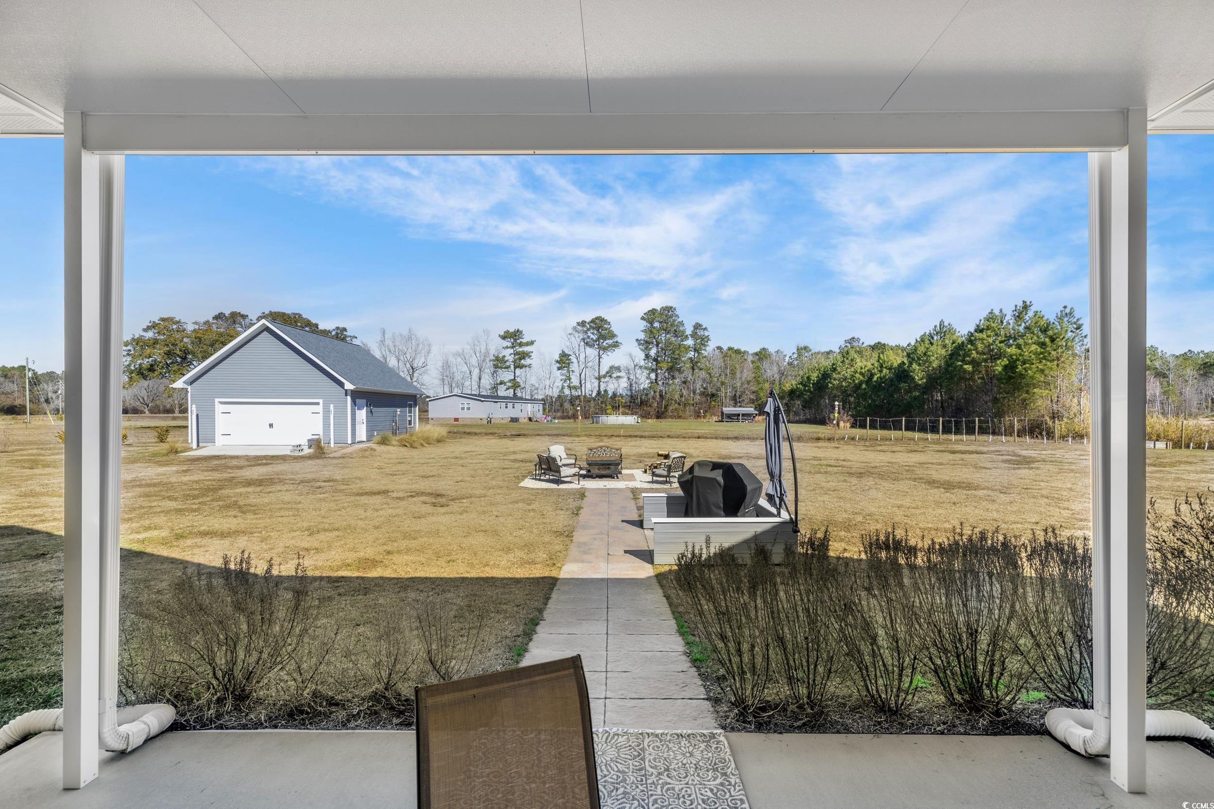 1464 West G Road Conway, SC 29526 - Photo 36 of 40 View of yard with a garage