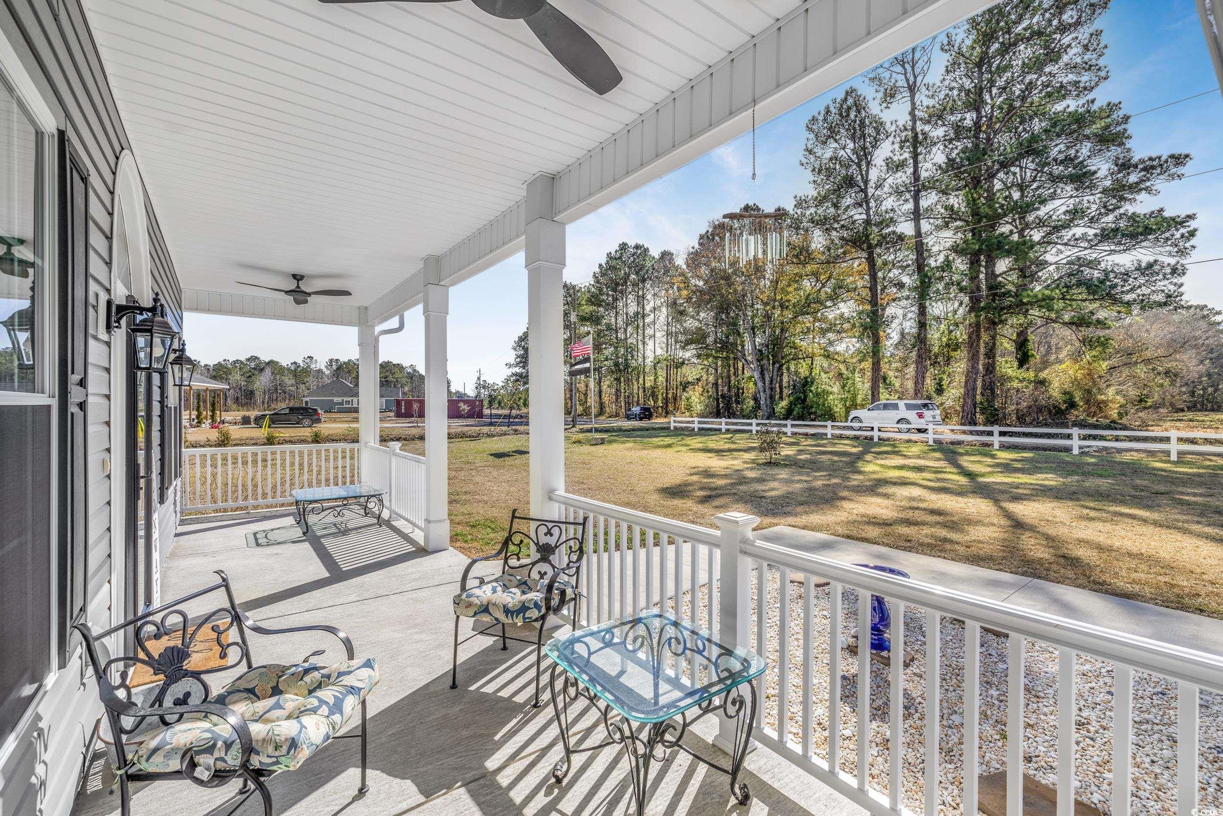 1464 West G Road Conway, SC 29526 - Photo 5 of 40 Wooden terrace featuring a yard, covered porch, an
