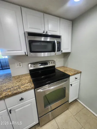 a view of a kitchen cabinets and a counter place