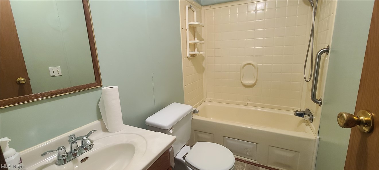 5974 Cleveland Road, Unit 19 Wooster, OH 44691 - Photo 16 of 17 Full bathroom featuring shower combination, vanity, and mirror