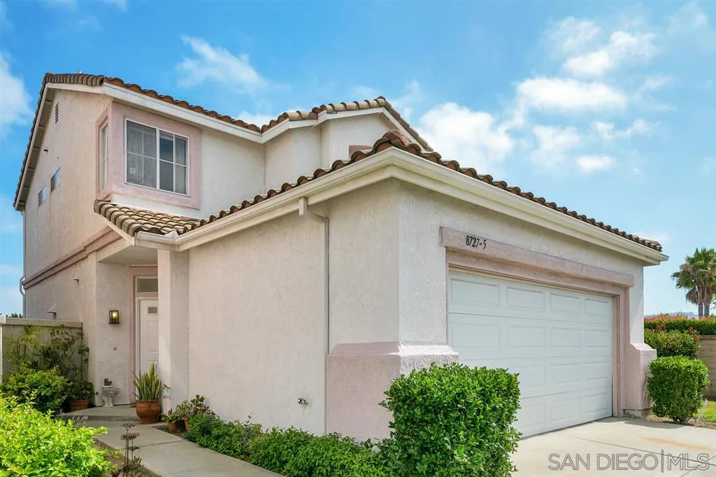 8727 Westmore Road, Unit 5 San Diego, CA 92126 - Photo 2 of 14 a white building with a small yard plants