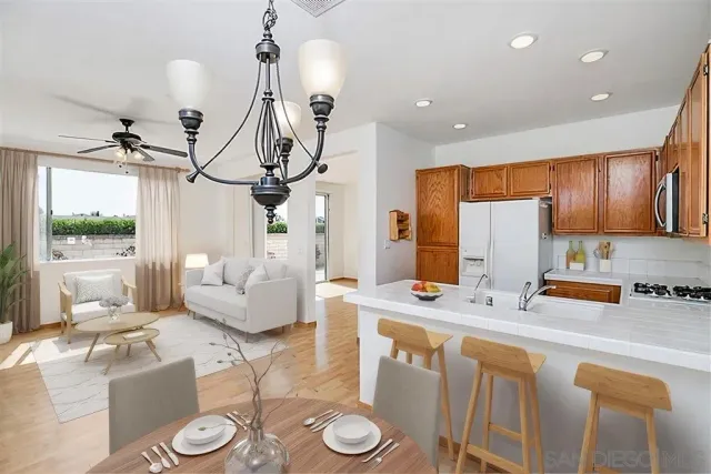 a view of a kitchen with a sink and a living room view